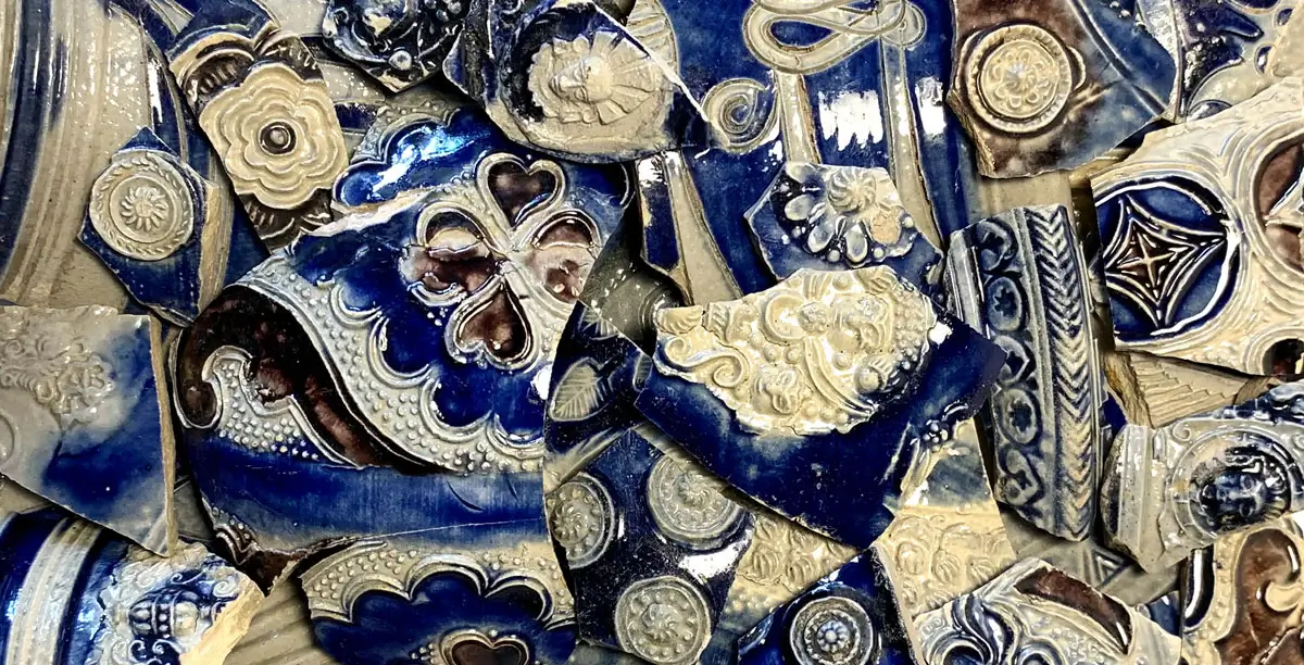 Ancient pottery shards with intricate patterns.