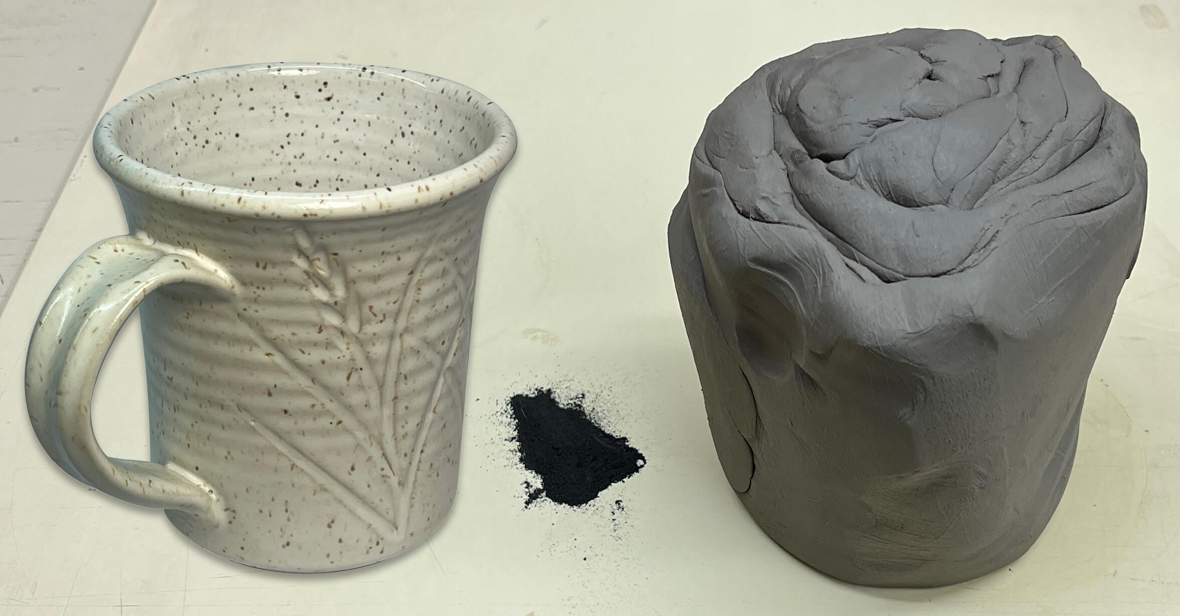 Lump of raw porcelain clay on a dark surface.