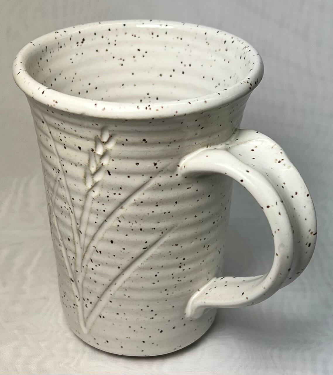 A finished, beautifully glazed porcelain teacup.