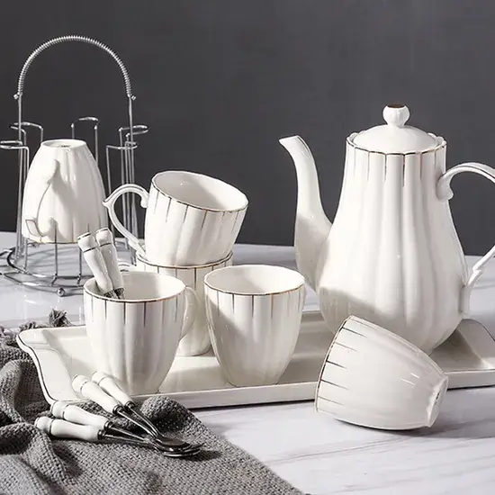 Tea set with intricate, hand-painted blue patterns.