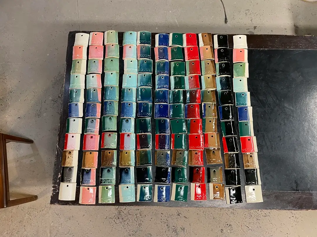A vibrant collection of glaze test tiles.