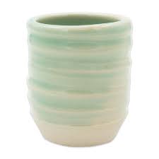 The 'Celadon' Mist set, glowing with its pale green, translucent glaze.